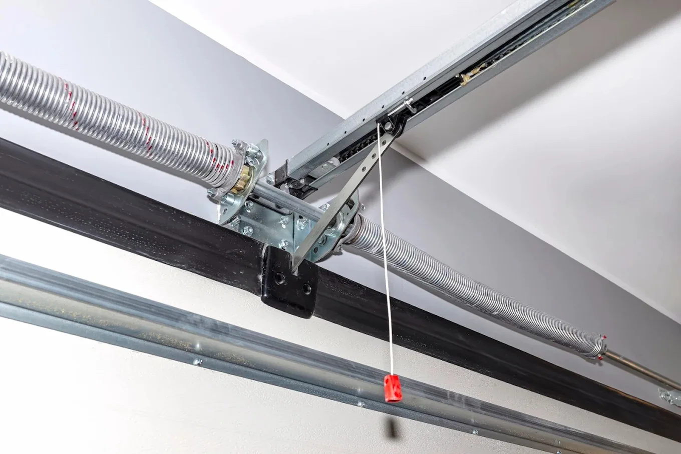 Garage door torsion spring and track hardware serviced by GTA Garages